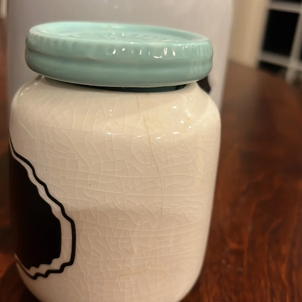 Two ceramic containers with covers and chalkboard labels